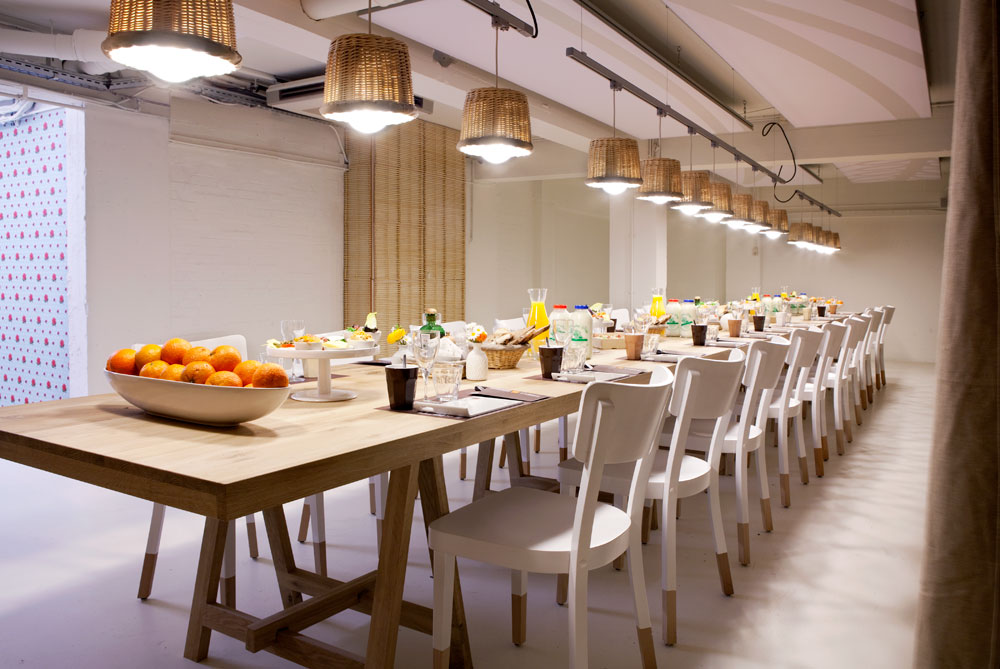 Vlaamsch Broodhuys long communal table with woven pendant lamps